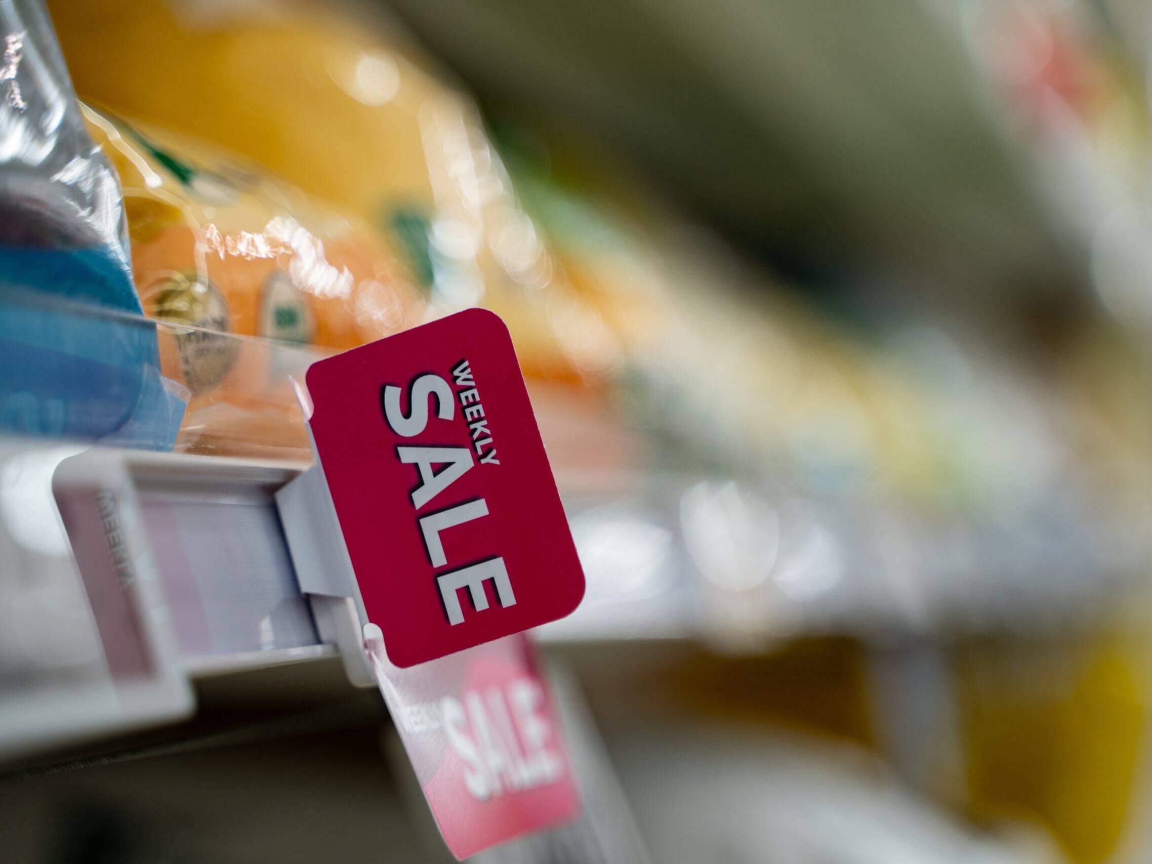 Weekly,Sale,Sign,On,Supermarket,Shelf,In,Grocery,Store.