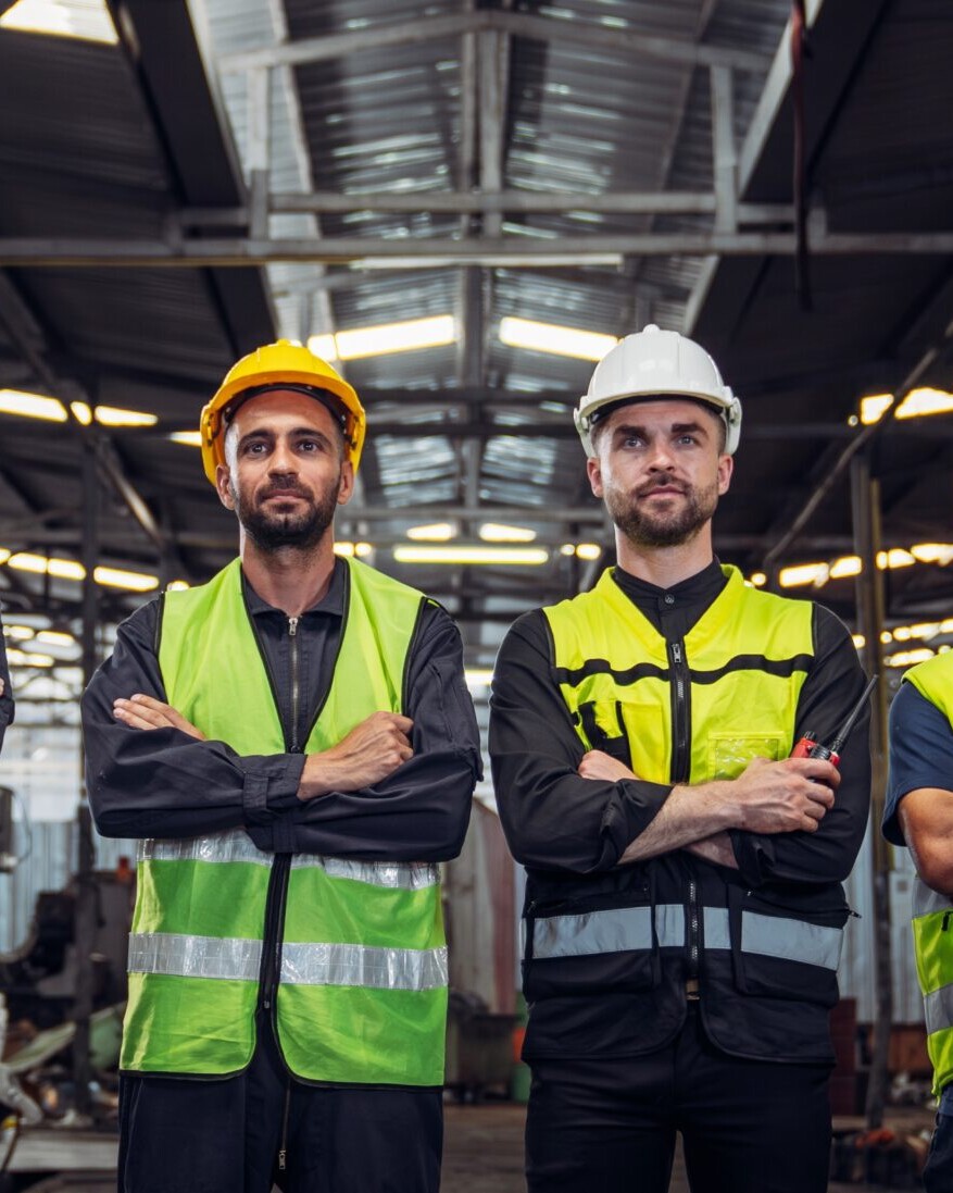 Portrait,Of,Group,Of,Team,Mechanical,Engineers,At,Factory,Machines.